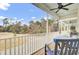 Expansive outdoor porch area with seating and wooded views at 129 Sabal Ct, Summerville, SC 29483