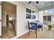 Cozy outdoor porch area with seating, a table, and view into the home at 129 Sabal Ct, Summerville, SC 29483