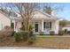 Inviting one-story home with front porch featuring an American flag at 1435 Swamp Fox Ln, Charleston, SC 29412