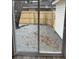 View of gravel backyard through sliding glass door at 1508 Greenbay Dr, North Charleston, SC 29406