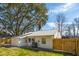 Back exterior featuring a metal roof, and wooden fence, perfect for outdoor relaxation at 1508 Greenbay Dr, North Charleston, SC 29406
