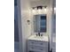 Bathroom featuring a white vanity with drawers, black hardware, and modern lighting at 1508 Greenbay Dr, North Charleston, SC 29406