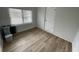 Bedroom with a window, a door, and white painted brick walls at 1508 Greenbay Dr, North Charleston, SC 29406