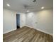 Bright bedroom with wood-look flooring, white trim, neutral walls, and a ceiling fan at 1508 Greenbay Dr, North Charleston, SC 29406