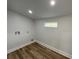 Clean, modern laundry room with wood-look flooring and bright natural light from a window at 1508 Greenbay Dr, North Charleston, SC 29406