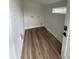 Newly renovated laundry room with white brick and hardwood floors at 1508 Greenbay Dr, North Charleston, SC 29406