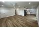 Spacious living room featuring modern flooring, white walls, recessed lights, and an open layout to the kitchen at 1508 Greenbay Dr, North Charleston, SC 29406