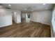 Spacious living room featuring recessed lighting, modern flooring, and access to the outside, with white trim at 1508 Greenbay Dr, North Charleston, SC 29406