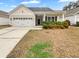 Charming single-story home with a two-car garage and manicured landscaping at 1556 Pixley St, Charleston, SC 29414