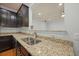 Kitchen area with granite countertops and stainless steel dishwasher and sink at 1706 Restoration Ct, Charleston, SC 29414