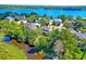 Aerial view of a residential property nestled among lush greenery with lake views at 1756 Indigo Island Dr, Hanahan, SC 29410