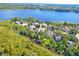 A stunning aerial view showcases this home's desirable location on the lake with ample surrounding greenery at 1756 Indigo Island Dr, Hanahan, SC 29410