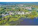 Beautiful aerial view of a home in a waterfront community surrounded by lush trees and marshland at 1756 Indigo Island Dr, Hanahan, SC 29410