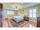 Bedroom with hardwood floors and large windows with wooden shutters at 1756 Indigo Island Dr, Hanahan, SC 29410