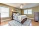 Bedroom with a large window, ceiling fan, hardwood floors and a queen-sized bed at 1756 Indigo Island Dr, Hanahan, SC 29410