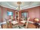 Inviting dining room with a decorative chandelier, seating for six, and elegant decor at 1756 Indigo Island Dr, Hanahan, SC 29410