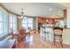 Open-concept dining area connects to kitchen, featuring natural light and seating at 1756 Indigo Island Dr, Hanahan, SC 29410