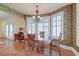 Charming dining area with a large bay window and a stylish chandelier at 1756 Indigo Island Dr, Hanahan, SC 29410