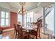 Elegant dining room with hardwood floors, chandelier, and stairway access, perfect for entertaining at 1756 Indigo Island Dr, Hanahan, SC 29410