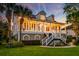 Charming two-story home with a welcoming porch, lush lawn, and beautiful landscaping at 1756 Indigo Island Dr, Hanahan, SC 29410
