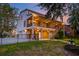 Charming two-story home with screened in back porch, garage, fenced-in yard and a manicured lawn at 1756 Indigo Island Dr, Hanahan, SC 29410