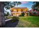 Beautiful exterior elevation of a two-story home with a well-manicured lawn, landscaping, and spacious backyard at 1756 Indigo Island Dr, Hanahan, SC 29410