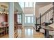 Spacious foyer with staircase, hardwood floors, and elegant chandelier, creating a grand entrance at 1756 Indigo Island Dr, Hanahan, SC 29410