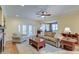 Bright living room with backyard access features comfortable seating, and a ceiling fan at 1756 Indigo Island Dr, Hanahan, SC 29410