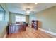Home office with a wooden desk, hardwood floors, and natural lighting at 1756 Indigo Island Dr, Hanahan, SC 29410