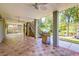 Expansive covered patio with tiled floors, outdoor grill, stairs, and ceiling fans for comfortable outdoor living at 1756 Indigo Island Dr, Hanahan, SC 29410