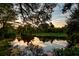 Scenic view of a tranquil pond reflecting the sky and surrounding foliage at 1756 Indigo Island Dr, Hanahan, SC 29410