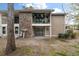 Backyard view of the townhouse with fenced yard, patio and lush plants on the balcony at 1860 Montclair Dr # 1860-A, Mount Pleasant, SC 29464