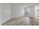 Bright bedroom features wood-look floors and a window with blinds, providing ample natural light at 1860 Montclair Dr # 1860-A, Mount Pleasant, SC 29464