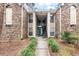 Apartment building exterior featuring a brick facade, light tan siding and outdoor stairs leading to upper units at 1860 Montclair Dr # 1860-A, Mount Pleasant, SC 29464
