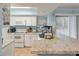 Bright kitchen with white cabinets, granite countertops, and modern appliances at 1860 Montclair Dr # 1860-A, Mount Pleasant, SC 29464