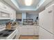 Kitchen featuring white cabinets, appliances, and a window offering natural light at 1860 Montclair Dr # 1860-A, Mount Pleasant, SC 29464