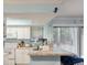 Well-lit kitchen with granite countertop, white cabinets, appliances and open access to a living space at 1860 Montclair Dr # 1860-A, Mount Pleasant, SC 29464