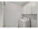 A compact laundry room features overhead cabinets and a white washing machine at 1860 Montclair Dr # 1860-A, Mount Pleasant, SC 29464