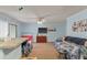Bright living room with a modern TV, comfortable sofas, and an adjacent pass-through to the kitchen at 1860 Montclair Dr # 1860-A, Mount Pleasant, SC 29464