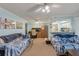 Cozy living room space with comfortable seating, ceiling fan, and a convenient kitchen pass-through for easy serving at 1860 Montclair Dr # 1860-A, Mount Pleasant, SC 29464