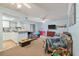Open-concept living room features cozy seating, a flat-screen TV, and access to a kitchen at 1860 Montclair Dr # 1860-A, Mount Pleasant, SC 29464