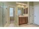 Bright bathroom featuring a glass-enclosed shower, tile flooring, and a modern vanity with ample storage at 2005 Carriage Way, Summerville, SC 29485