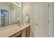 Bright bathroom with a vanity, a large mirror, and a door to an enclosed shower at 2005 Carriage Way, Summerville, SC 29485