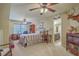 Spacious bedroom with ceiling fan, desk, and en-suite bathroom access for added convenience at 2005 Carriage Way, Summerville, SC 29485