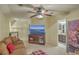 Upstairs bonus room with a comfortable couch, a media center, and an adjacent full bathroom at 2005 Carriage Way, Summerville, SC 29485