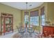 This lovely breakfast nook is filled with light and features an ornate china cabinet at 2005 Carriage Way, Summerville, SC 29485