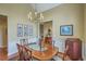 This dining room has a chandelier and wooden table at 2005 Carriage Way, Summerville, SC 29485