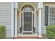 This home features a classic front door with sidelights at 2005 Carriage Way, Summerville, SC 29485