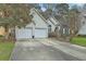 Charming home with a two-car garage and well-manicured landscaping in a beautiful, quiet neighborhood at 2005 Carriage Way, Summerville, SC 29485
