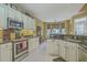 This kitchen features stainless steel appliances, granite countertops, and a breakfast nook at 2005 Carriage Way, Summerville, SC 29485